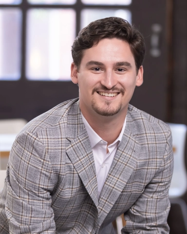 portrait of a smiling person in professional attire